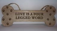'Love is' bone shaped sign